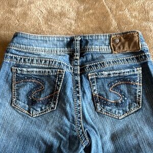 Silver Jeans Blue Boot Cut Denim with Distinctive Stitching